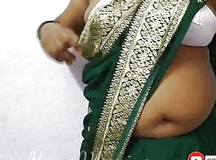Aunty in a Sexy Saree wearing a bra