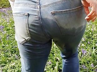 ? Blonde Girl Pissing Her Jeans Amongst The Flowers In Public!