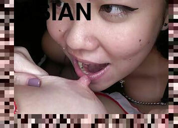 Hand expressing milk into Asian lesbian mouth - Hd