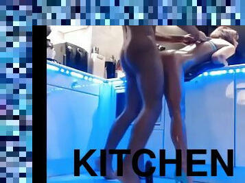 Toned heels bent over in kitchen