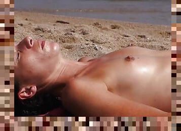 Tanning babes with perky tits at the beach