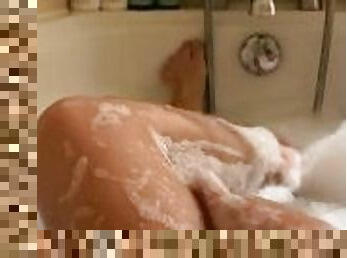 Home alone wife teasing in bath