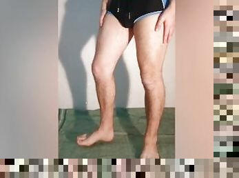 The guy shows what a chastity belt looks like under his clothes - a chastity cage in swimming trunks