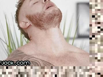 Muscled and tattooed jock jerks cock and cums in solo action