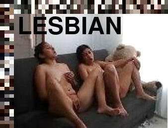 two latinas fingering their beautiful pussies watching lesbian porn.