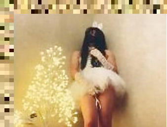 Chinese ladyboy wearing white gauze skirt cums next to Christmas tree