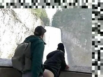 Fucking outdoors in front of a public waterfall