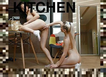 Alluring girls make out in charming oral scenes while in the kitchen