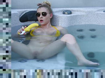 Sweet blonde inserts big dildo in her shaved pussy while in the pool