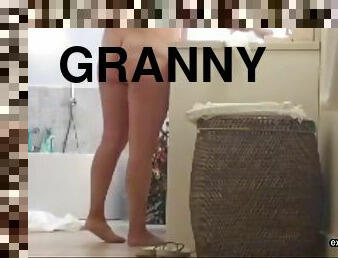 Our curvy granny was spied on in the bathroom