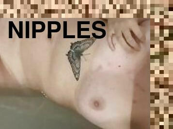 teen girl playing with sore nipples in bathtub