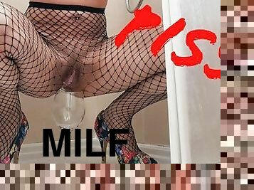 Pissing a drink in heels and stockings