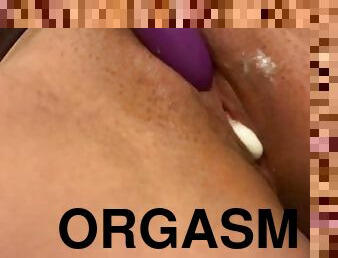 Vibe on clit making orgasm