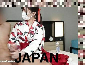 Japanese girl wearing kimono licks a guy's nipples with hand job.