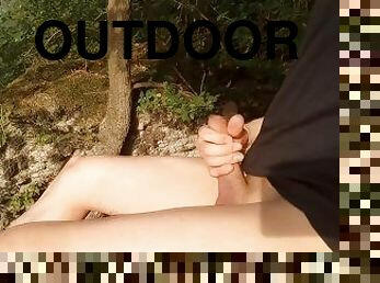 Boy cumming on his feet in flip flops after wanking outdoors. Foot fetish video
