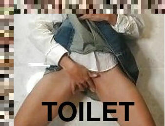 Red head girl pissing in school toilet on the floor