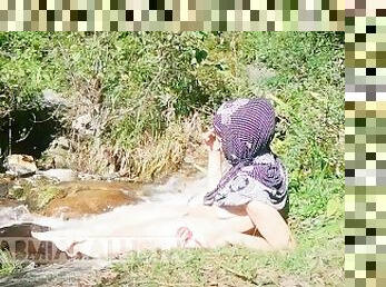 Shameless Muslim slut topless in hijab Smoking in nature