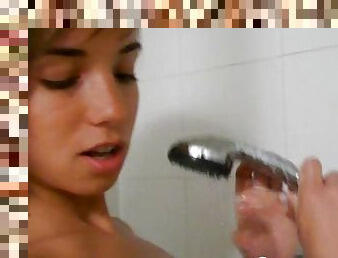 Hottie in the shower enjoys teasing the camera