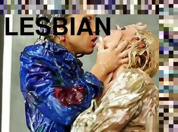 Bukkake covered lesbian pussy fisted at the gloryhole
