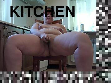 Chubby with fat ass fucks anal with cucumber, organic masturbation in the kitchen.