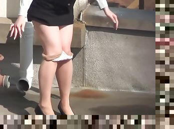 Asian ho peeing her panties in street