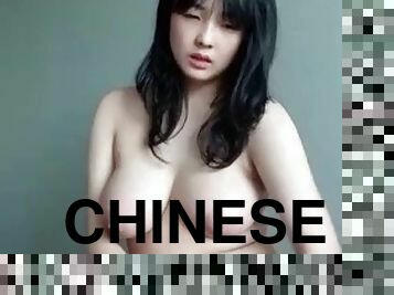 Cute Chinese girl masturbates while standing