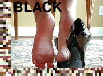I wear black shoes with a high heel open on the side.