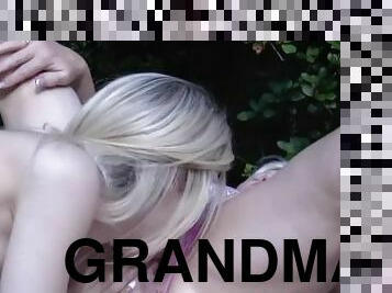 Grandma toyed outdoors by busty lesbian