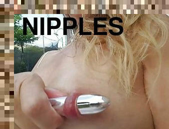 nippleringlover outside vibrator through large gauge pierced nipples & inserting it in pierced pussy
