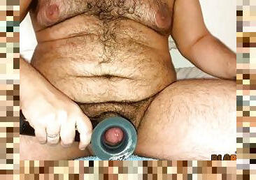 Hairy fat bear trying a milking machine for the first time, cumshots flying everywhere