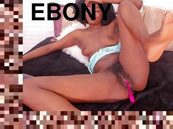 Ebony girl is teasing her hairy pussy