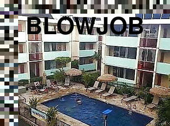 hot babe gives a blowjob on a balcony