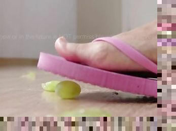 Flip Flops Walking Over Grapes