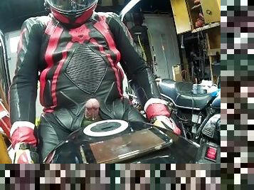 Leather biker milked on his motorcycle