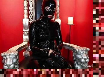 Behind the Scenes - Heavy Rubber Dominatrix putting her latex gloves on in dungeon