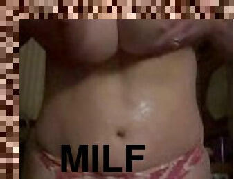 Horny Big Tit MILF oils breasts