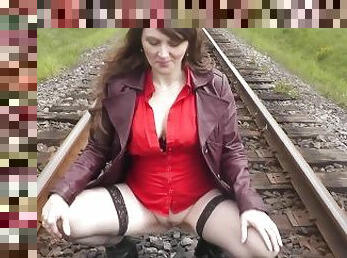 Naked in public. MILF pissing on train tracks and putting on panties near passing train. Golden Rain