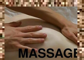 A girl with a gorgeous figure enjoys an oil massage