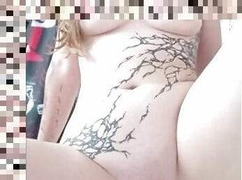Tattooed girl pissing in bathtub