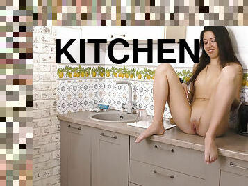 Brunette teen Katty West masturbates solo in the kitchen