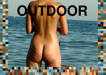 Various pussies at the nudist beach outdoors in voyeur video