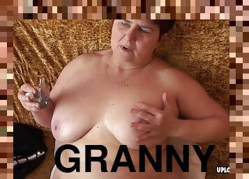 Granny with big boobs displays her body