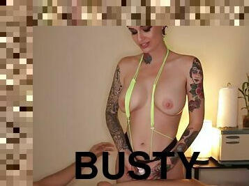 Busty tattooed masseuse in skimpy bikini jerks off clients cock