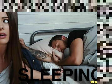 A slutty girlfriend fucks a stranger in the hostel while her BF sleeps
