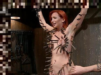 Redhead slave gets whole body clamped