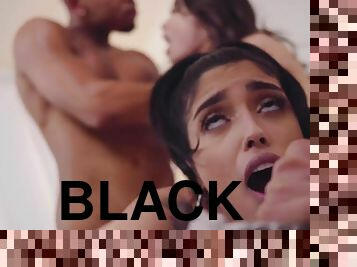 Liv Wild rolls her eyes back with pleasure as a black man works on her pussy