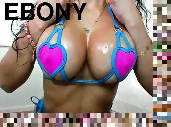 Playful ebony Latina with monster boobs in micro bikini takes shower