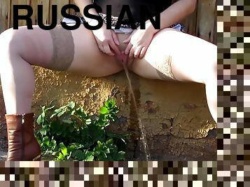 Russian dark haired chicks enjoy pissing on camera