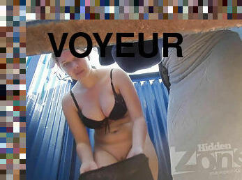 Voyeur girls dressed in beach cabin.