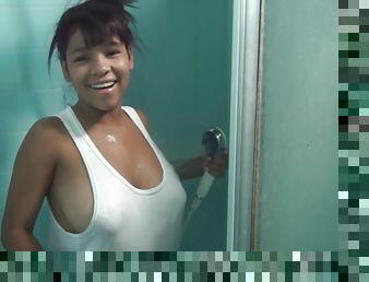 Young Latina with big naturals gets her big juggs wet in shower